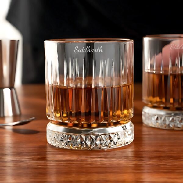 Personalized Crystal Whiskey Glass with Custom Name Engraving – Diamond Cut Base Elevate your whiskey-drinking experience with our Personalized Crystal Whiskey Glass featuring deep name engraving and a stunning diamond-cut base. Designed for sophistication and durability, this glass is perfect for savoring your favorite whiskey, bourbon, or scotch in style.