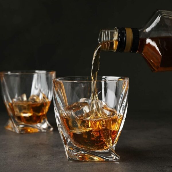 PREMIUM DESIGN: Elegant crystal whiskey glass with unique geometric base pattern and personalised engraving for a sophisticated drinking experience CUSTOMISATION: Features decorative 'Happy Birthday' text with space for personalised name and date engraving CONSTRUCTION: Made from high-quality crystal glass that offers exceptional clarity and brilliant refraction of light VERSATILE USE: Perfect for serving whiskey, scotch, bourbon, or other premium spirits with a capacity suitable for standard pours DIMENSIONS: Distinctive twisted base design with substantial weight and stability for comfortable handling
