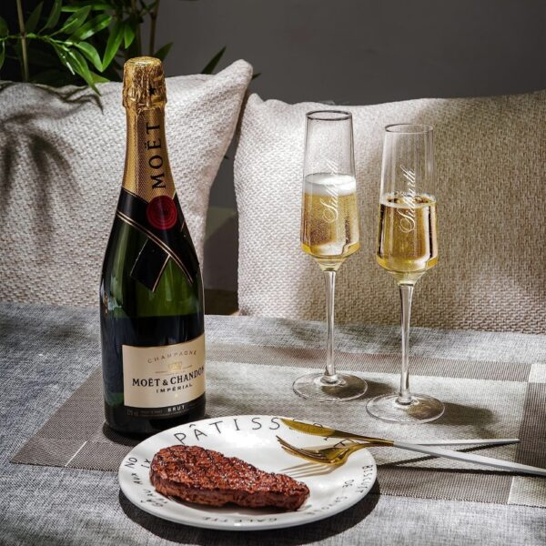 Elevate your special celebrations with these exquisite personalized champagne flutes. Each glass features a contemporary geometric design with an elegant, elongated stem that adds sophistication to any occasion. The crystal-clear glassware is enhanced with deep, precision-engraved customisation that maintains its beauty through countless toasts. These premium flutes come as a matching set of two, perfect for wedding ceremonies, anniversaries, or any momentous occasion. The modern angular bowl design helps preserve the bubbles while concentrating the champagne's aroma. The sturdy base ensures stability, whilst the tall, graceful stem allows for proper holding without warming the champagne. These bespoke glasses make for a treasured keepsake that couples can use to celebrate their special moments for years to come. Each flute is carefully crafted to hold the perfect amount of champagne, making them ideal for those celebratory toasts. The sophisticated design complements any table setting, from casual gatherings to formal events.