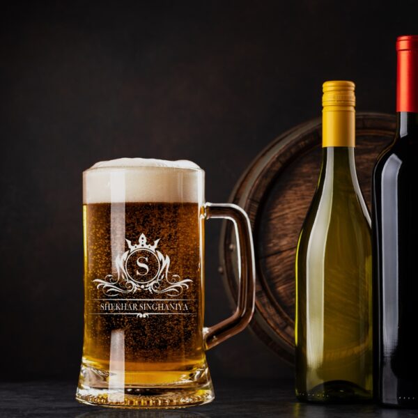 Elevate your drinking experience with this exquisite 500ml personalised beer mug, featuring an elegant crown monogram design. The crystal-clear glass construction showcases your favourite brew while adding a touch of sophistication with its beautifully engraved pattern. Perfect as a thoughtful gift for special occasions, this sturdy mug combines classic styling with personalised charm. The comfortable handle provides a secure grip, whilst the generous 500ml capacity ensures ample room for your preferred beverage. The premium quality glass material preserves your drink's temperature and carbonation, making every sip as enjoyable as the first. Whether it's for Christmas, birthdays, or any celebration, this customised beer mug makes for a memorable present that's both practical and stylish. The intricate crown design and monogram add a royal touch to this drinking vessel, making it a cherished addition to any collection. Suitable for various beverages, this mug promises to be a conversation starter at gatherings and a treasured keepsake for years to come.