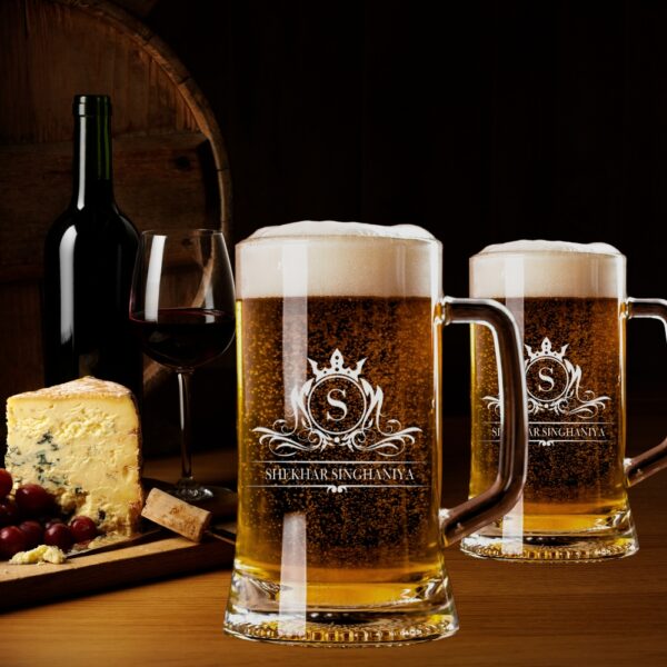 Elevate your drinking experience with this exquisite 500ml personalised beer mug, featuring an elegant crown monogram design. The crystal-clear glass construction showcases your favourite brew while adding a touch of sophistication with its beautifully engraved pattern. Perfect as a thoughtful gift for special occasions, this sturdy mug combines classic styling with personalised charm. The comfortable handle provides a secure grip, whilst the generous 500ml capacity ensures ample room for your preferred beverage. The premium quality glass material preserves your drink's temperature and carbonation, making every sip as enjoyable as the first. Whether it's for Christmas, birthdays, or any celebration, this customised beer mug makes for a memorable present that's both practical and stylish. The intricate crown design and monogram add a royal touch to this drinking vessel, making it a cherished addition to any collection. Suitable for various beverages, this mug promises to be a conversation starter at gatherings and a treasured keepsake for years to come.