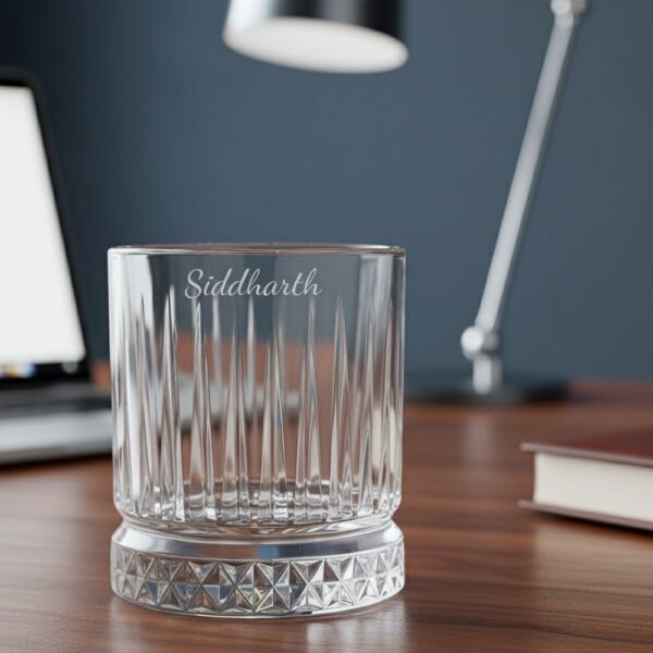Best2U Personalized Crystal Whiskey Glass with custom name engraving “Siddharth.” This 330ml glass features a sophisticated vertical line pattern and a diamond-cut base that reflects light elegantly. Crafted from premium crystal, the glass combines clarity and durability, making it ideal for whiskey, scotch, or bourbon. The deep engraving ensures the name remains permanent, while the classic design enhances any home bar setting.