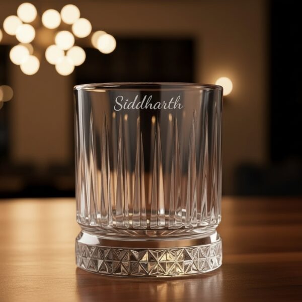 Best2U Personalized Crystal Whiskey Glass with custom name engraving “Siddharth.” This 330ml glass features a sophisticated vertical line pattern and a diamond-cut base that reflects light elegantly. Crafted from premium crystal, the glass combines clarity and durability, making it ideal for whiskey, scotch, or bourbon. The deep engraving ensures the name remains permanent, while the classic design enhances any home bar setting.