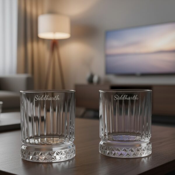 Best2U Personalized Crystal Whiskey Glass with custom name engraving “Siddharth.” This 330ml glass features a sophisticated vertical line pattern and a diamond-cut base that reflects light elegantly. Crafted from premium crystal, the glass combines clarity and durability, making it ideal for whiskey, scotch, or bourbon. The deep engraving ensures the name remains permanent, while the classic design enhances any home bar setting.