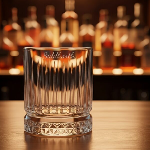 Best2U Personalized Crystal Whiskey Glass with custom name engraving “Siddharth.” This 330ml glass features a sophisticated vertical line pattern and a diamond-cut base that reflects light elegantly. Crafted from premium crystal, the glass combines clarity and durability, making it ideal for whiskey, scotch, or bourbon. The deep engraving ensures the name remains permanent, while the classic design enhances any home bar setting.