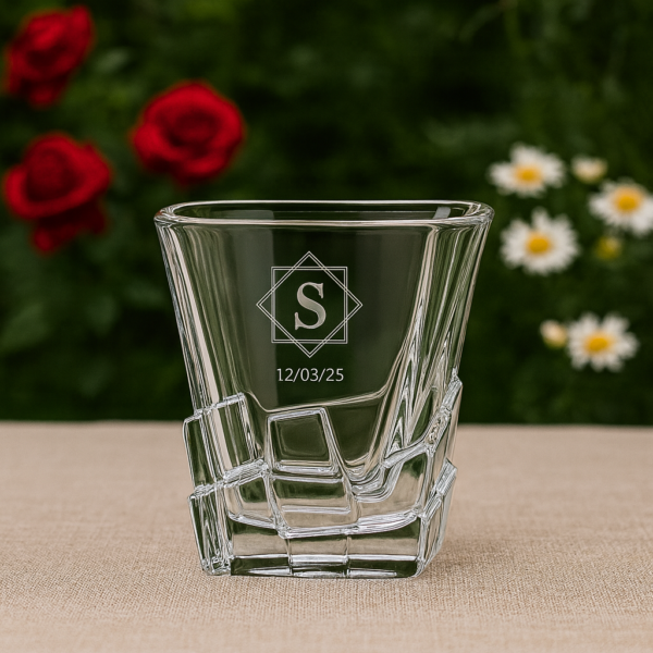Personalized 310ml crystal whisky glass with twisted base design, engraved with custom monogram and date, displayed on a dark surface