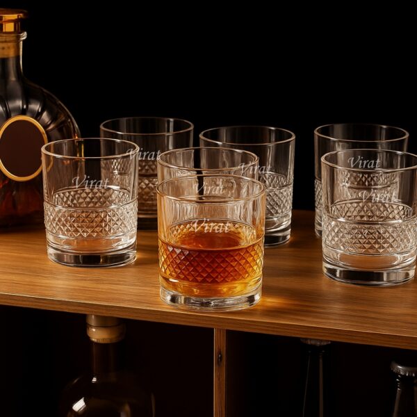 Personalized engraved whiskey glass with geometric diamond-cut design and name engraving