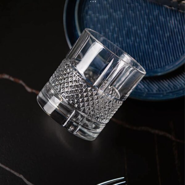 Personalized engraved whiskey glass with geometric diamond-cut design and name engraving